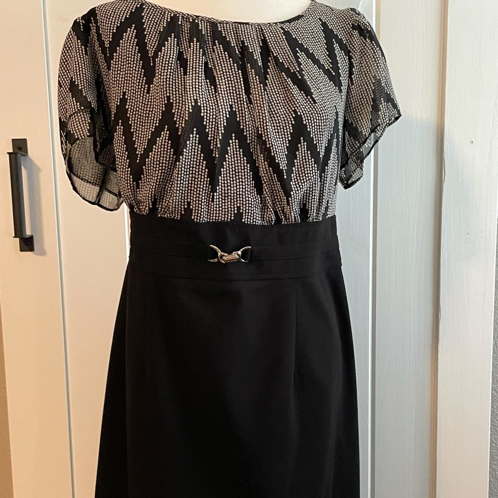 Dress is flattering with a wider waist band.